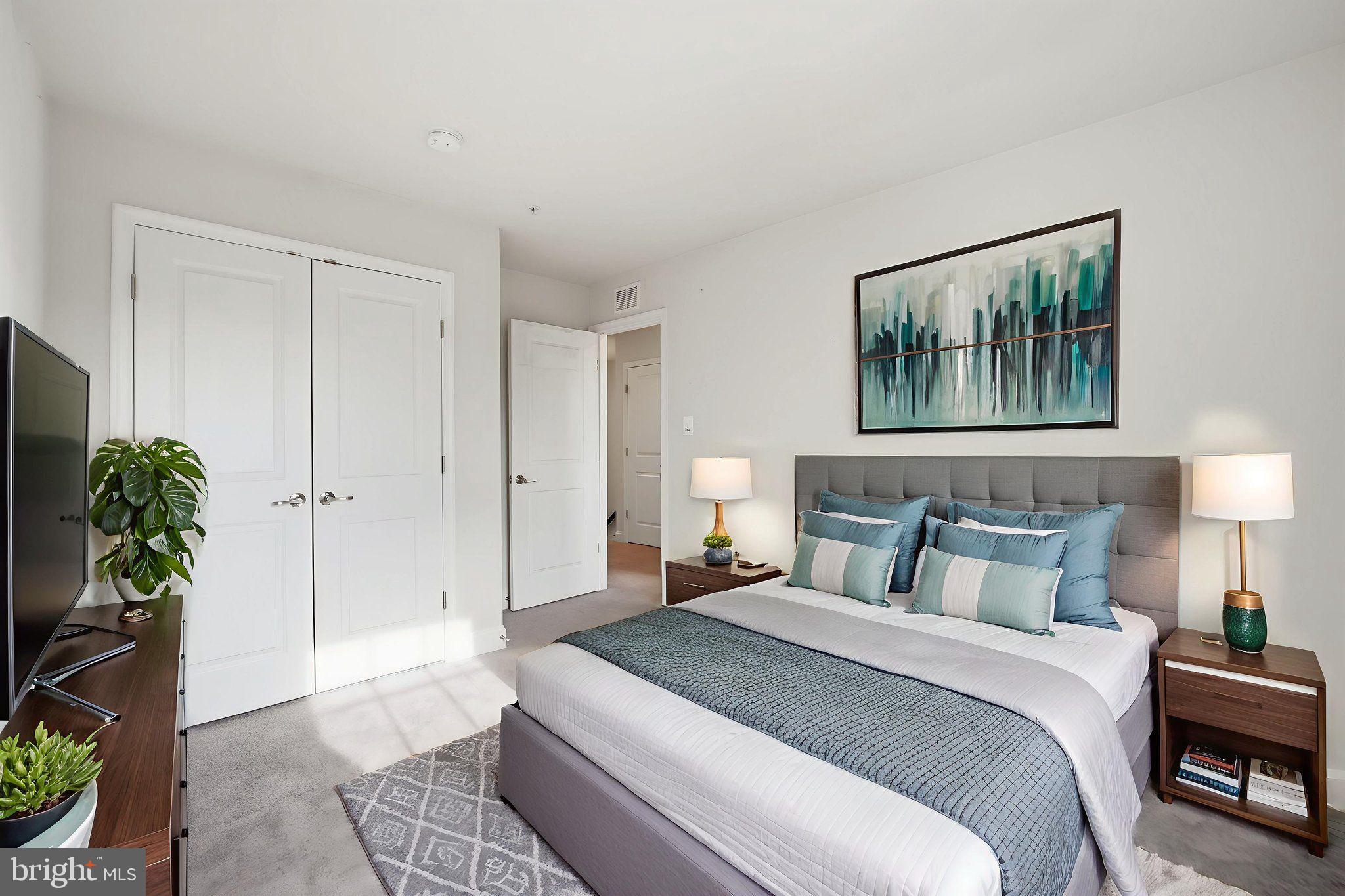 3623 Duckhorn Way Laurel, MD 20724 - Photo 32 of 48 a bedroom with a bed and a potted plant