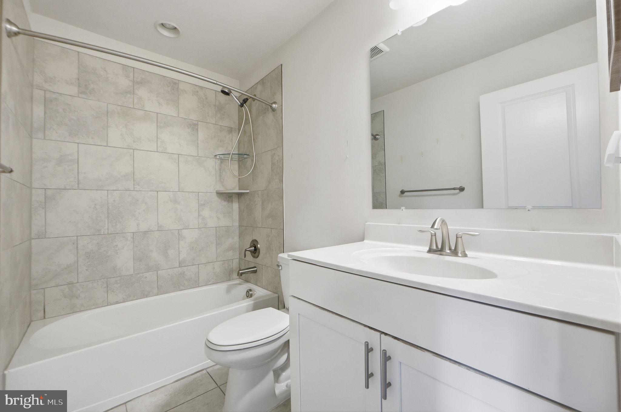 3623 Duckhorn Way Laurel, MD 20724 - Photo 33 of 48 a bathroom with a sink toilet and shower
