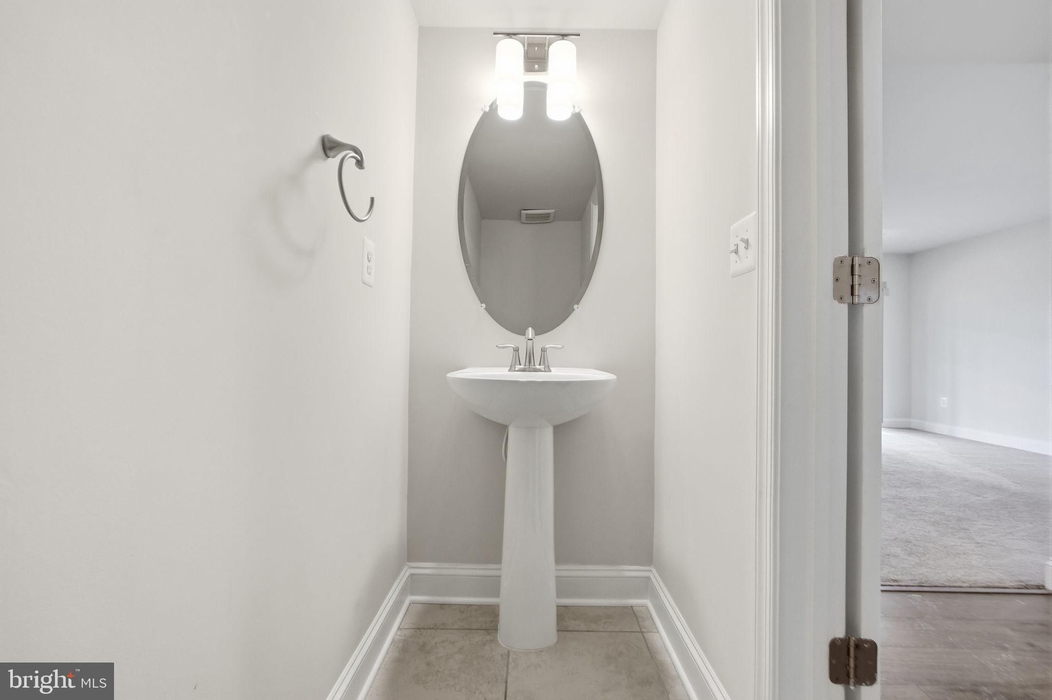 3623 Duckhorn Way Laurel, MD 20724 - Photo 6 of 48 a bathroom with a sink and a mirror