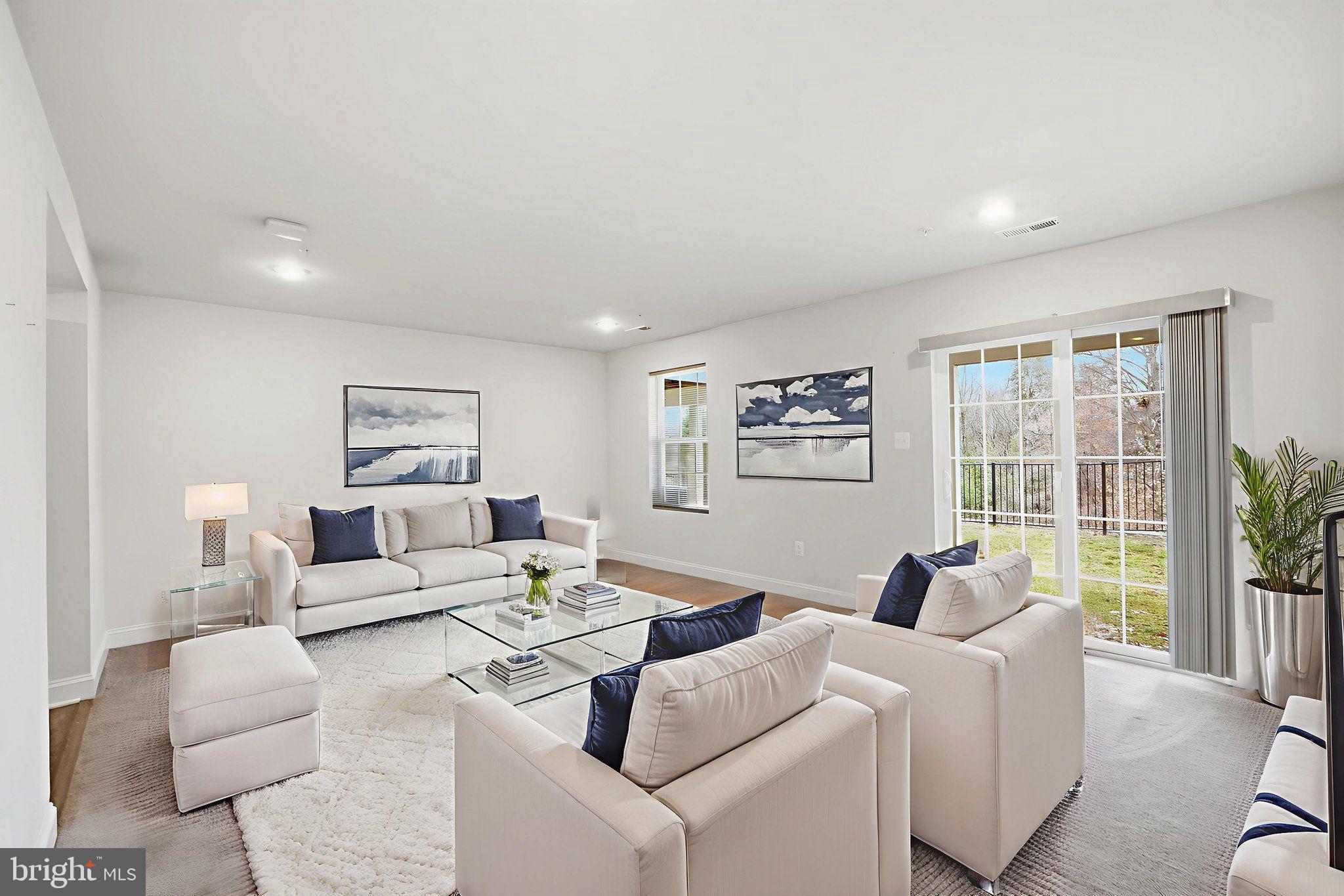 3623 Duckhorn Way Laurel, MD 20724 - Photo 9 of 48 a living room with furniture and a large window