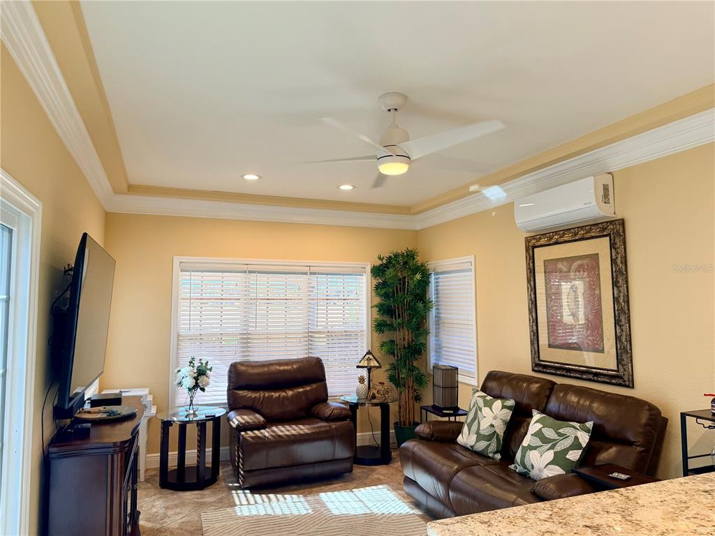 9516 Southeast 47th Way Webster, FL 33597 - Photo 19 of 43 a living room with furniture windows and a flat screen tv