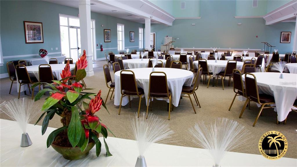 9516 Southeast 47th Way Webster, FL 33597 - Photo 34 of 43 a living room with lots of furniture and a chandelier