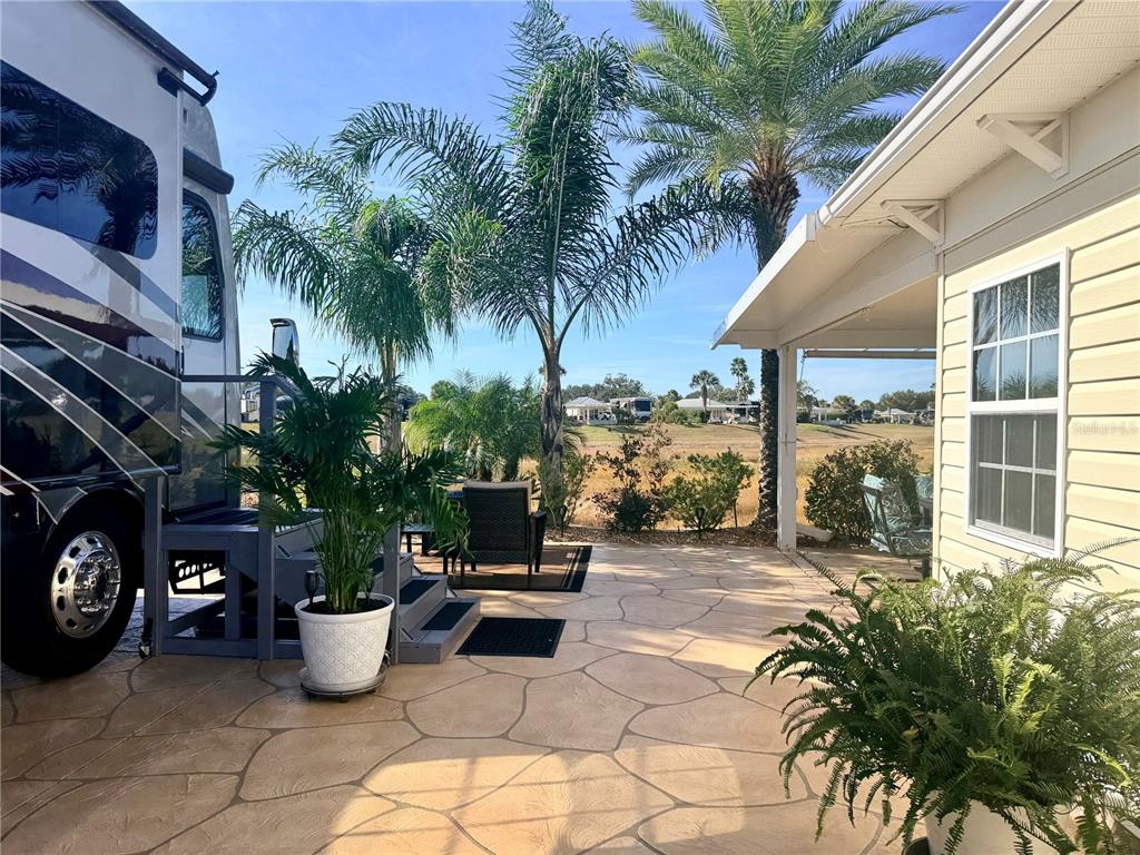 9516 Southeast 47th Way Webster, FL 33597 - Photo 8 of 43 a view of a patio with a dining table and chairs