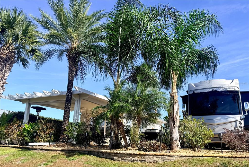 9516 Southeast 47th Way Webster, FL 33597 - Photo 10 of 43 a front view of house with yard and swimming pool