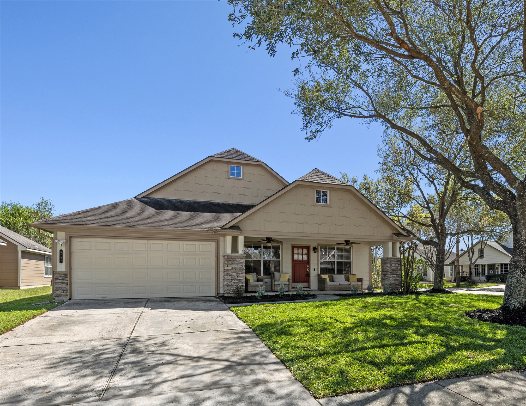 5727 Valley Scene Way Spring, TX 77379 - Photo 1 of 37 Charming single-story home with a welcoming front porch, spacious two-car garage, and a well-maintained lawn.