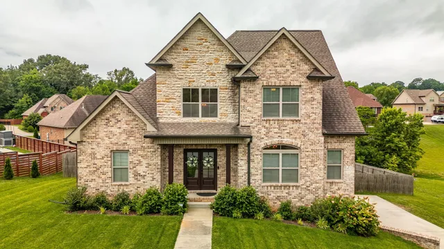 front view of a house with a yard