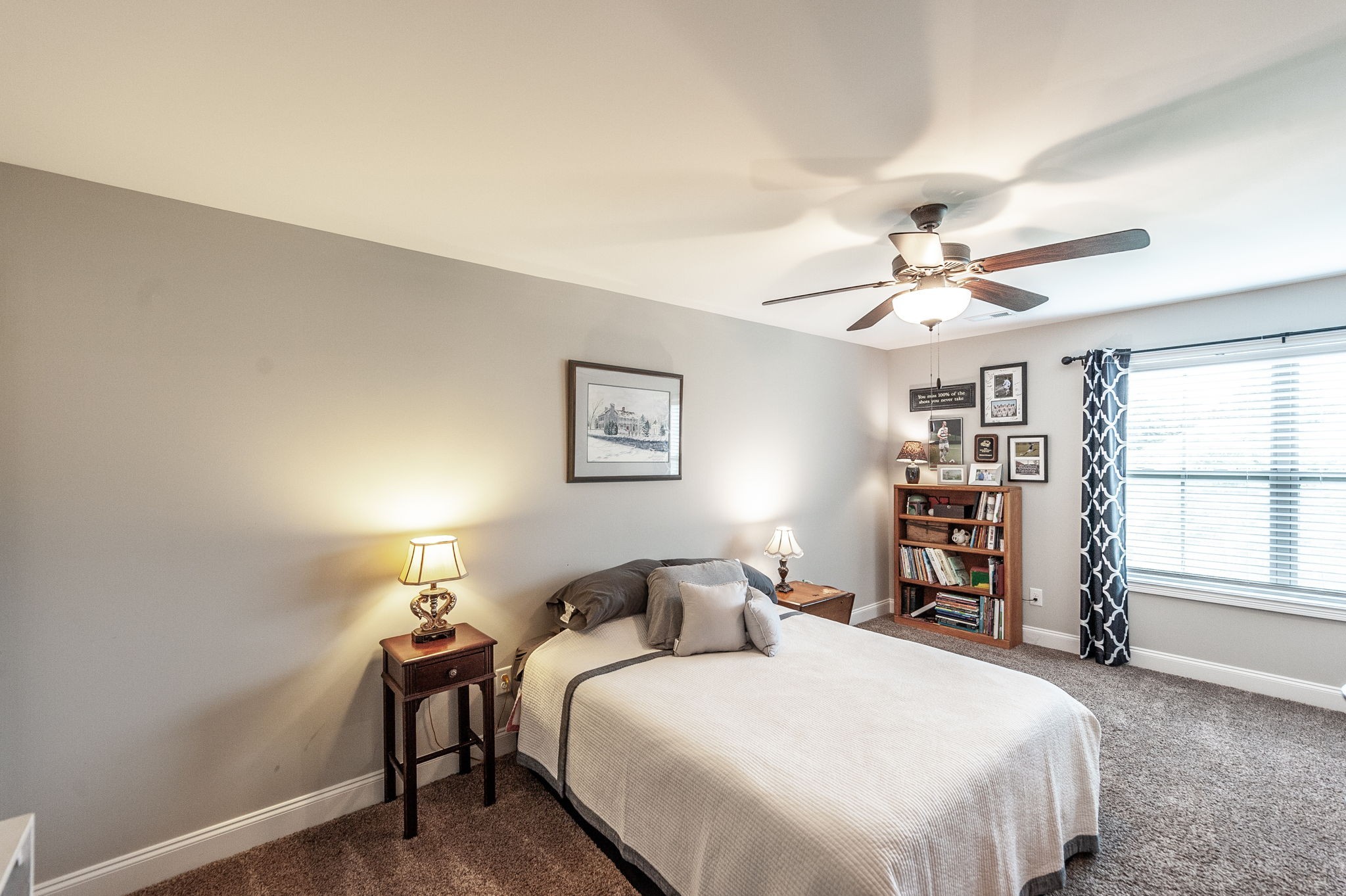 1184 Wicke Road Adams, TN 37010 - Photo 24 of 41 a bedroom with a bed and a chandelier