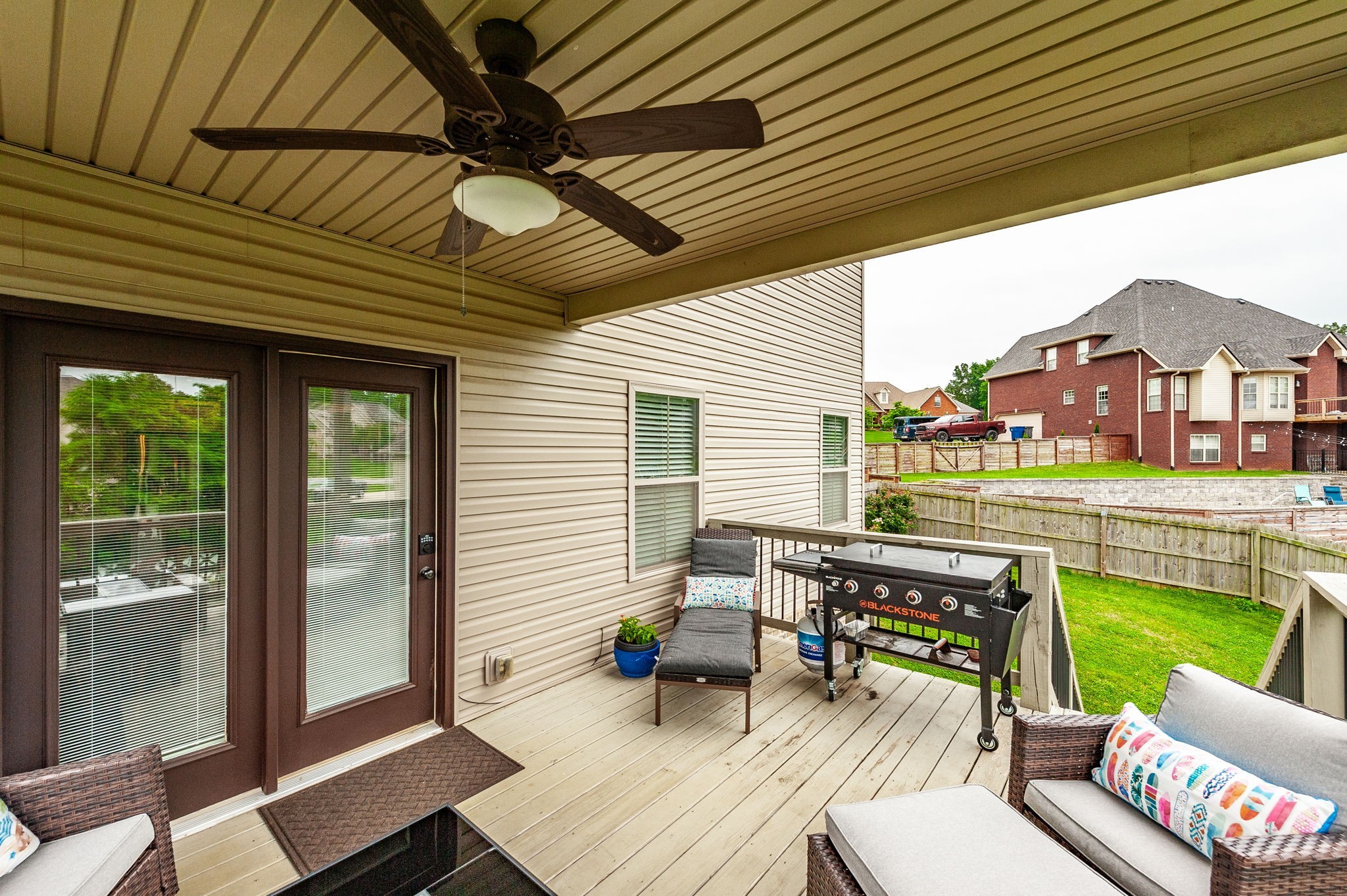 1184 Wicke Road Adams, TN 37010 - Photo 28 of 41 a outdoor space with patio the couches and pool table with chairs and potted plants
