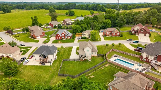 an aerial view of a house with outdoor space