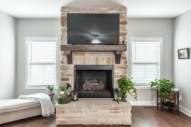 a living room with furniture and a fireplace
