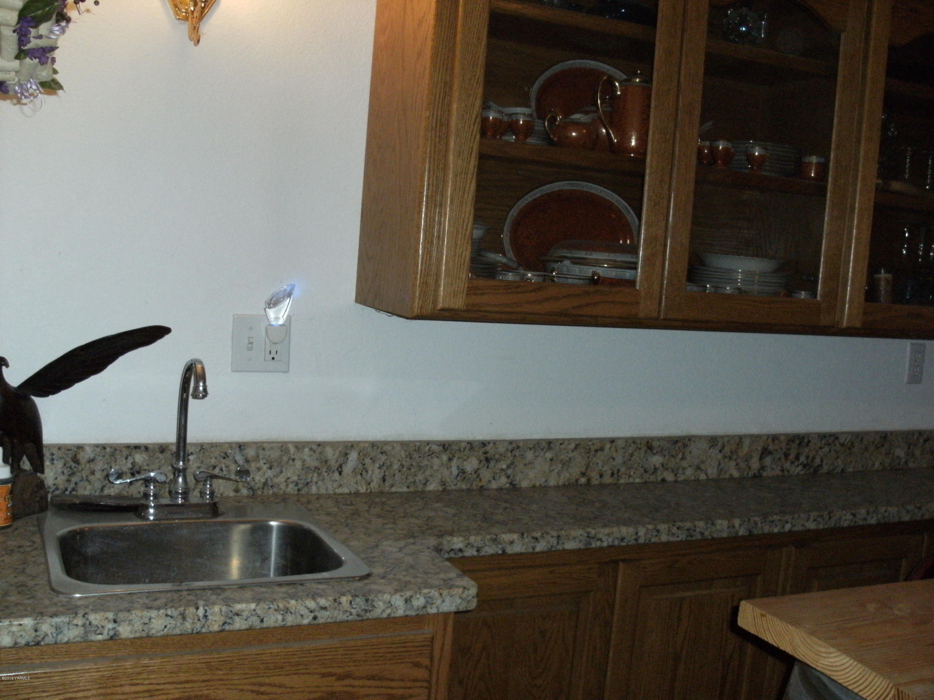 1009 Thornton Road Sunnyside, WA 98944 - Photo 11 of 18 a close view of a sink and stove in a kitchen