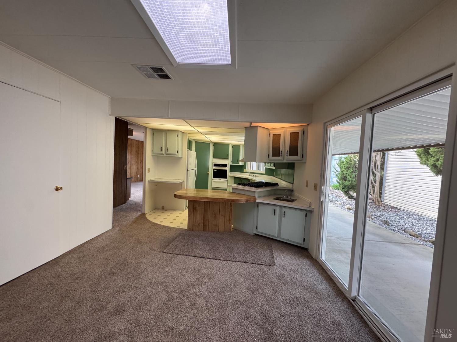 91 Greenrock Court Santa Rosa, CA 95409 - Photo 16 of 31 a kitchen with a refrigerator and microwave