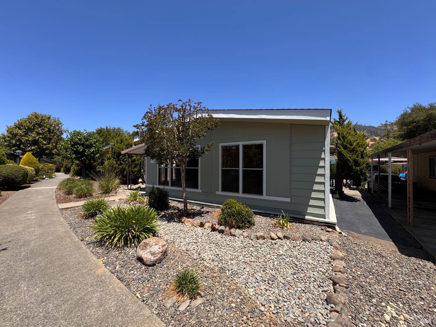 91 Greenrock Court Santa Rosa, CA 95409 - Photo 2 of 31 a front view of a house with a yard