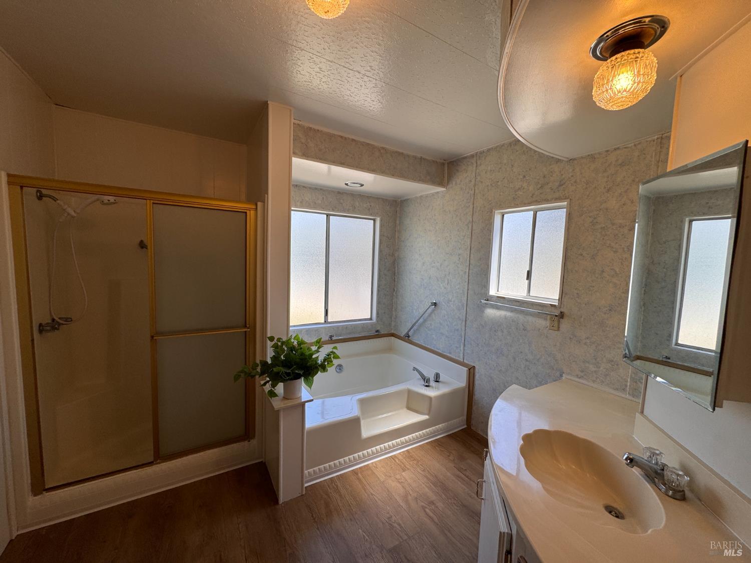 91 Greenrock Court Santa Rosa, CA 95409 - Photo 23 of 31 a bathroom with a tub sink and mirror