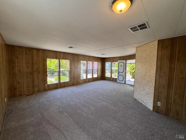 a view of a livingroom with furniture and window