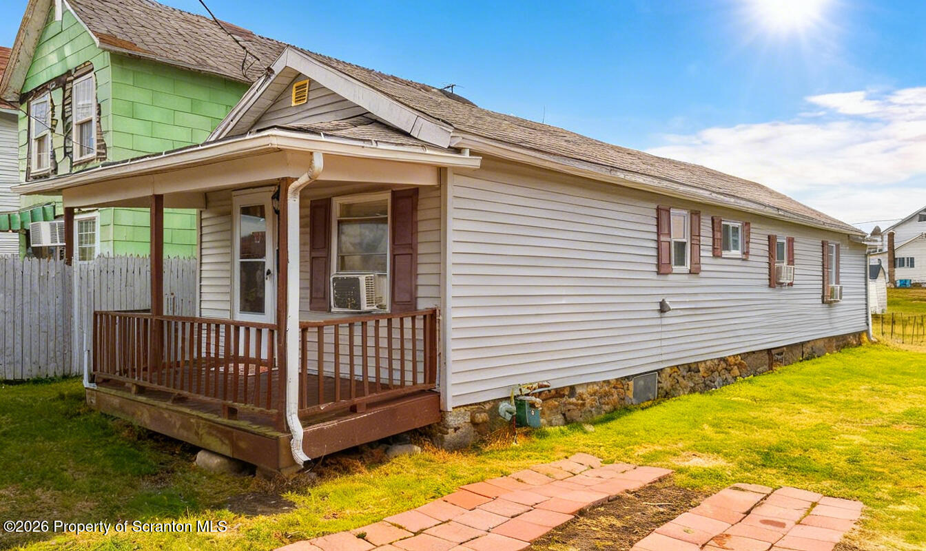 138 Swetland Street Duryea, PA 18642 - Photo 1 of 34 a view of a house with a backyard and wooden roof