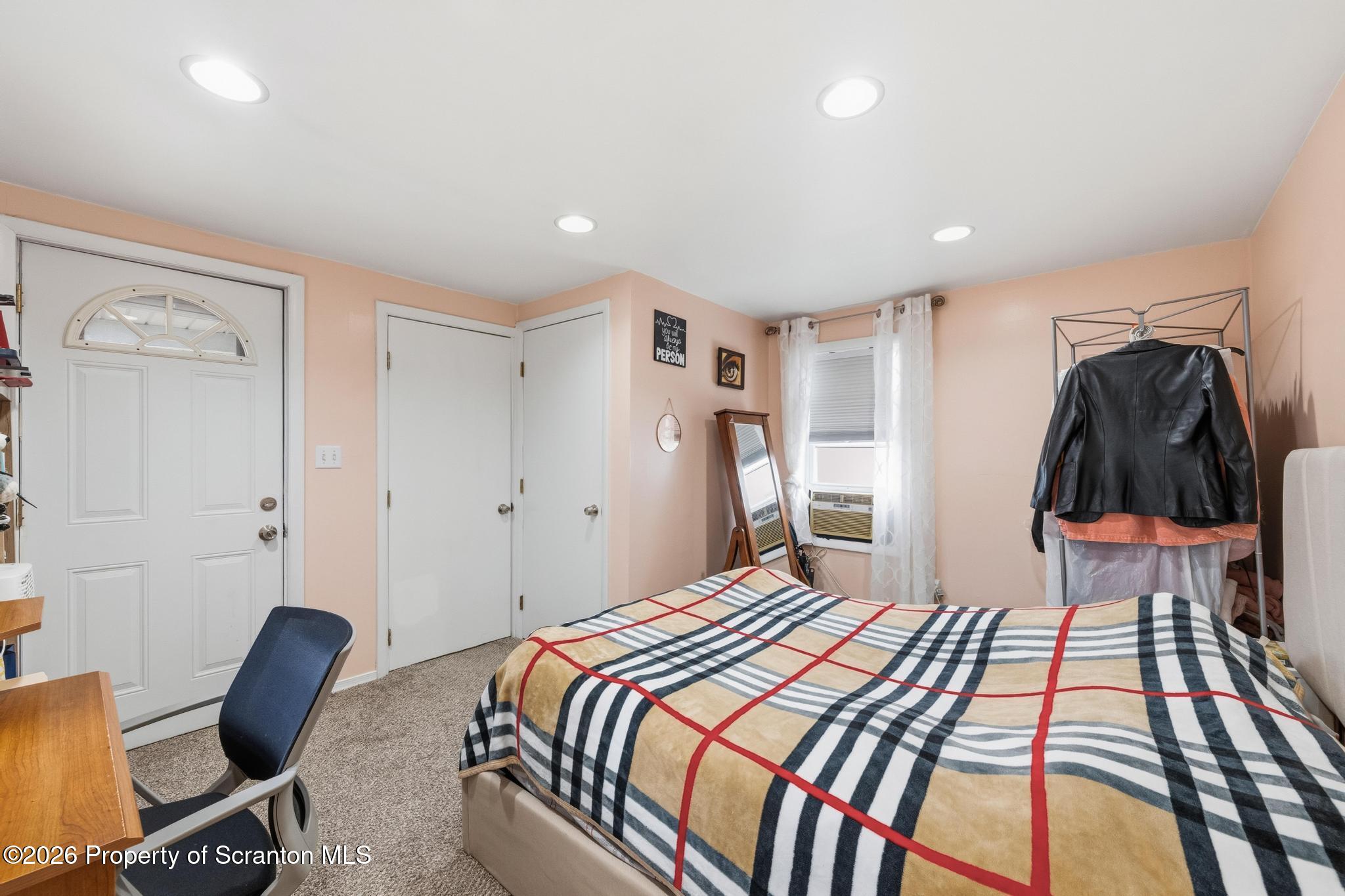 138 Swetland Street Duryea, PA 18642 - Photo 14 of 34 a bedroom with a bed and a desk