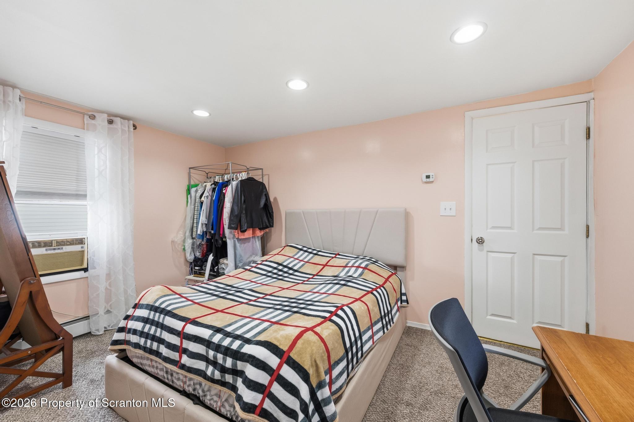 138 Swetland Street Duryea, PA 18642 - Photo 16 of 34 a bedroom with a bed and a window