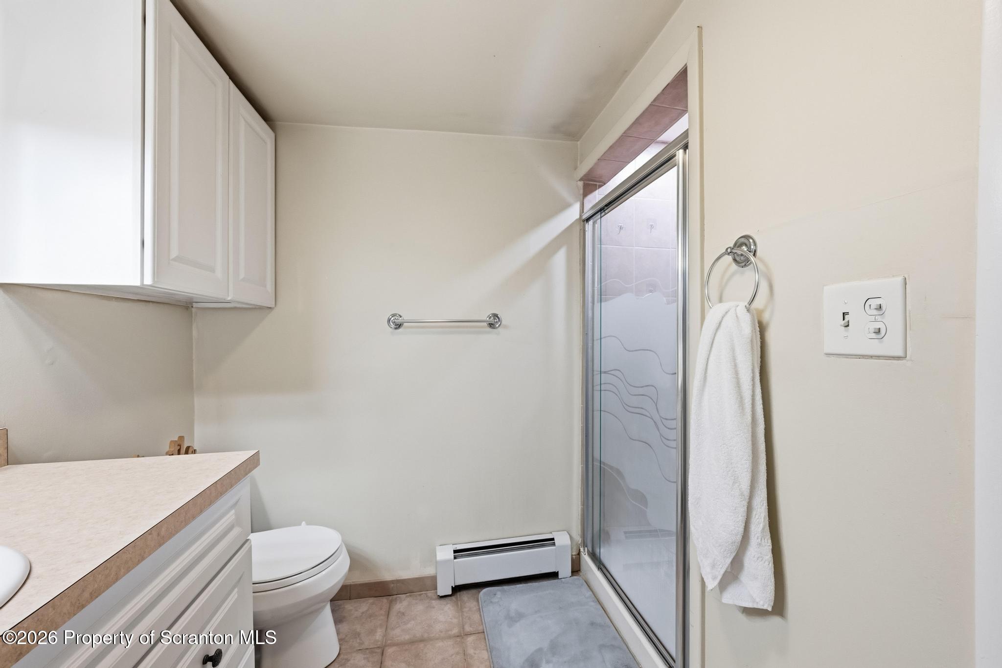 138 Swetland Street Duryea, PA 18642 - Photo 19 of 34 a bathroom with a granite countertop sink toilet and shower