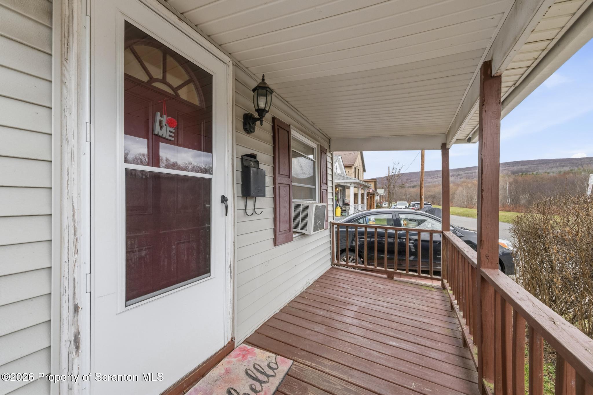 138 Swetland Street Duryea, PA 18642 - Photo 28 of 34 a view of a balcony with furniture and wooden floor