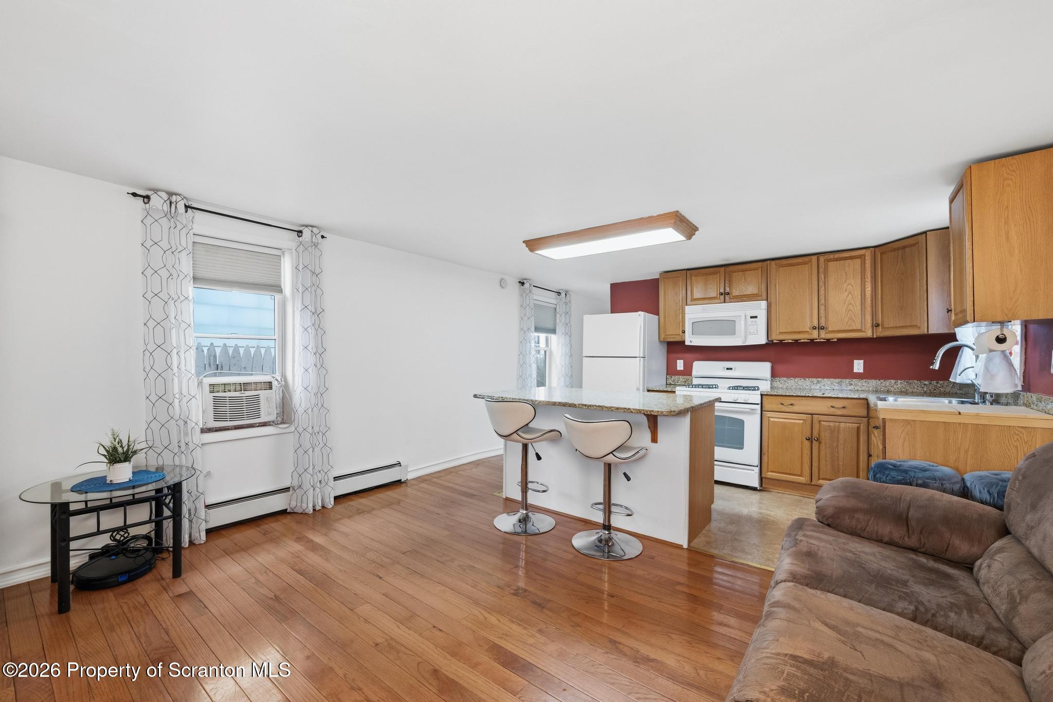 138 Swetland Street Duryea, PA 18642 - Photo 4 of 34 a kitchen with a sink cabinets and wooden floor