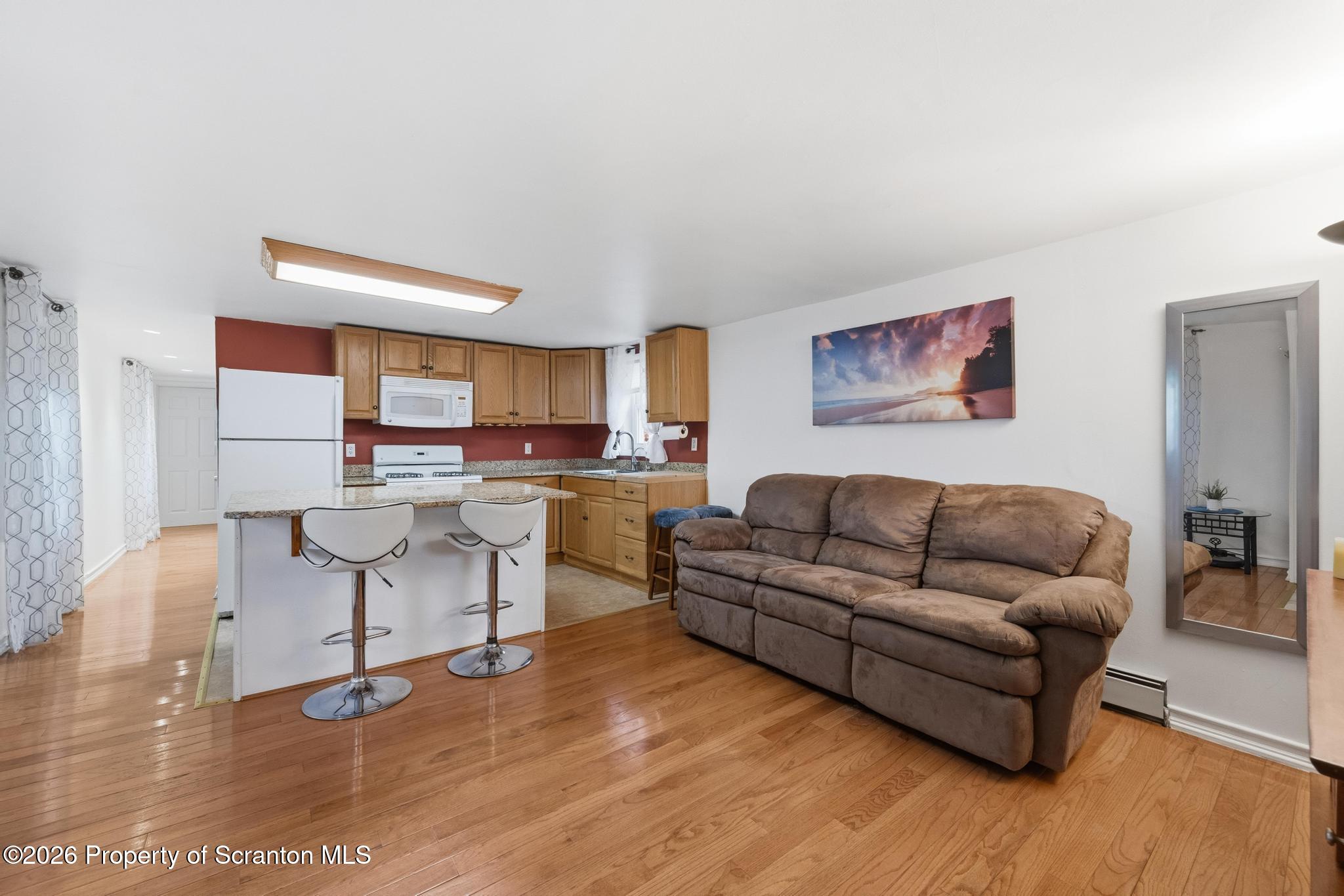 138 Swetland Street Duryea, PA 18642 - Photo 6 of 34 a living room with furniture and kitchen view