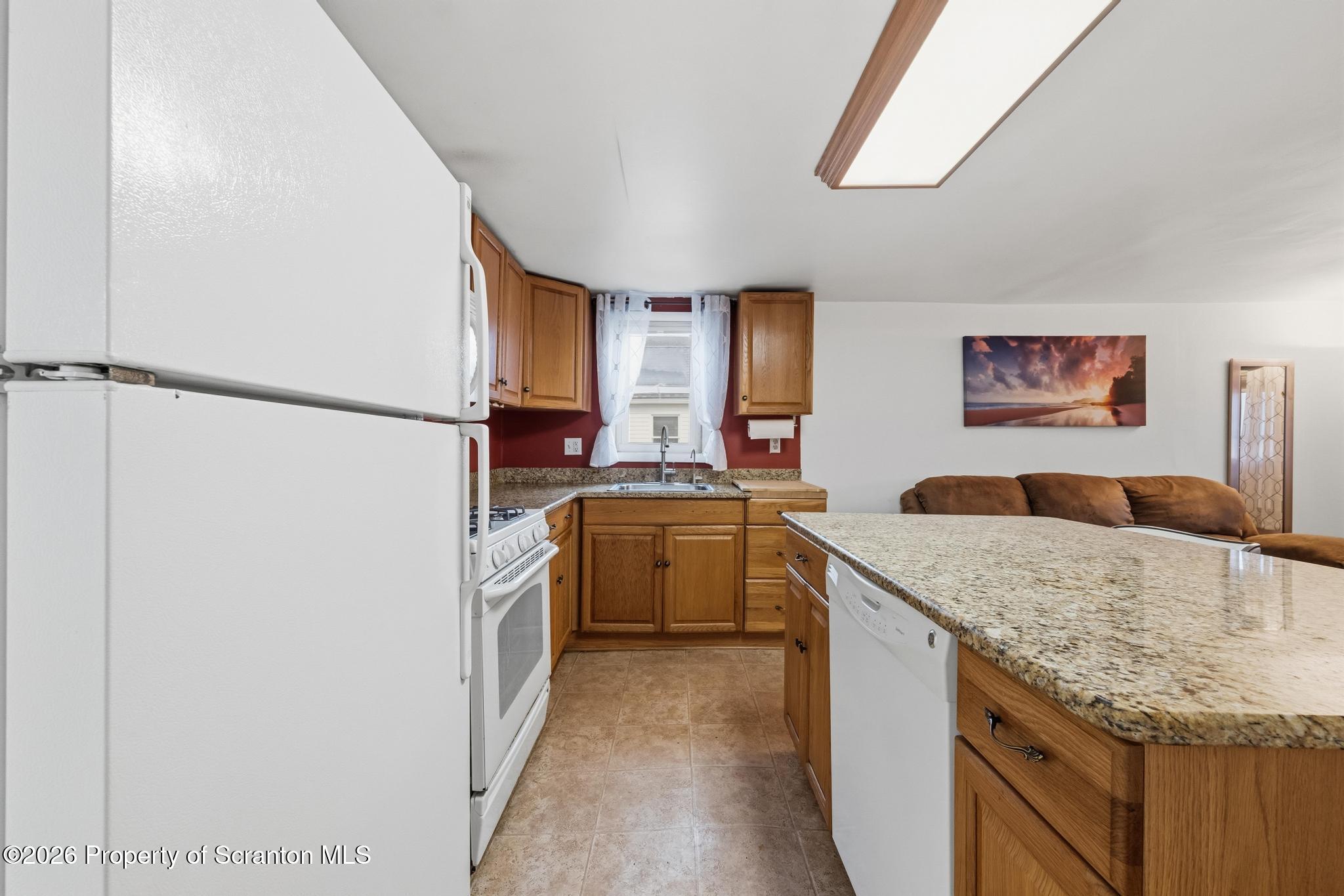 138 Swetland Street Duryea, PA 18642 - Photo 8 of 34 a kitchen with a sink stove and refrigerator