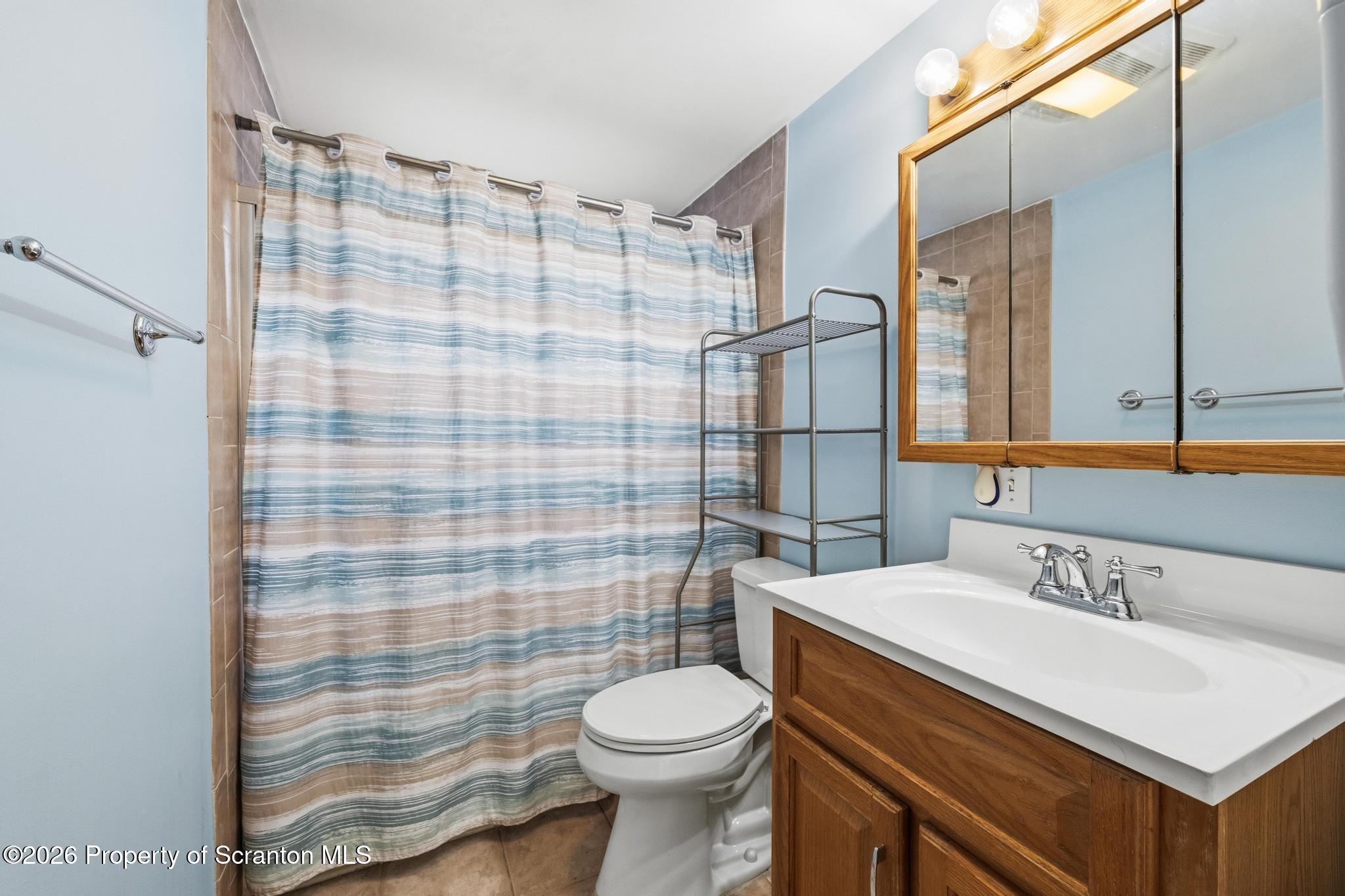 138 Swetland Street Duryea, PA 18642 - Photo 10 of 34 a bathroom with a sink toilet and shower