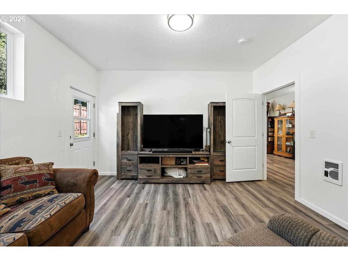 34155 Southeast Moss Hill Road Estacada, OR 97023 - Photo 12 of 26 a living room with furniture and a flat screen tv