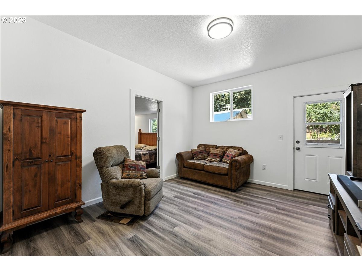 34155 Southeast Moss Hill Road Estacada, OR 97023 - Photo 13 of 26 a living room with furniture and a wooden floor