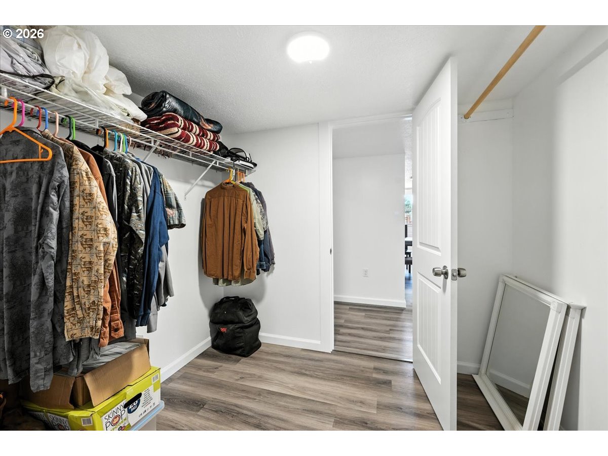 34155 Southeast Moss Hill Road Estacada, OR 97023 - Photo 16 of 26 a view of walk in closet with clothes and shoes