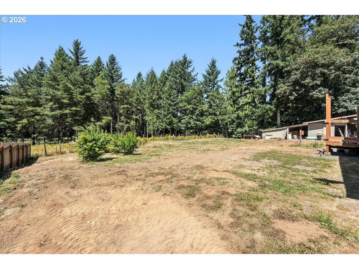 34155 Southeast Moss Hill Road Estacada, OR 97023 - Photo 24 of 26 a backyard of a house with table and chairs