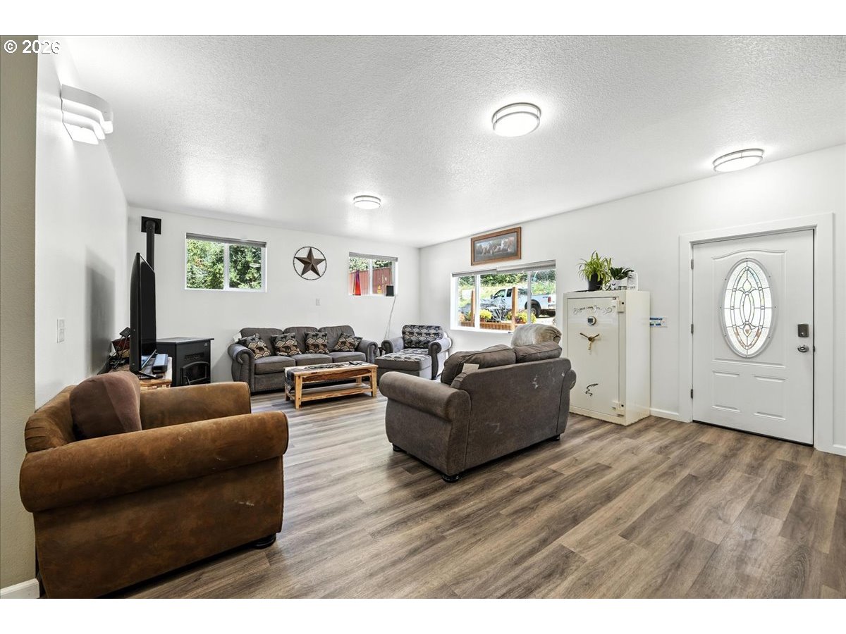 34155 Southeast Moss Hill Road Estacada, OR 97023 - Photo 5 of 26 a living room with furniture and a wooden floor