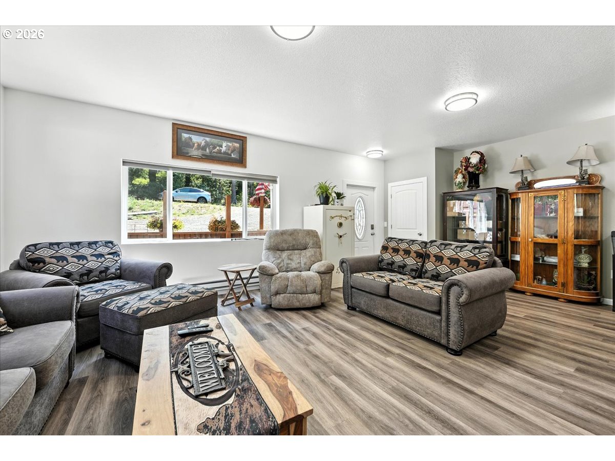 34155 Southeast Moss Hill Road Estacada, OR 97023 - Photo 6 of 26 a living room with furniture and a large window