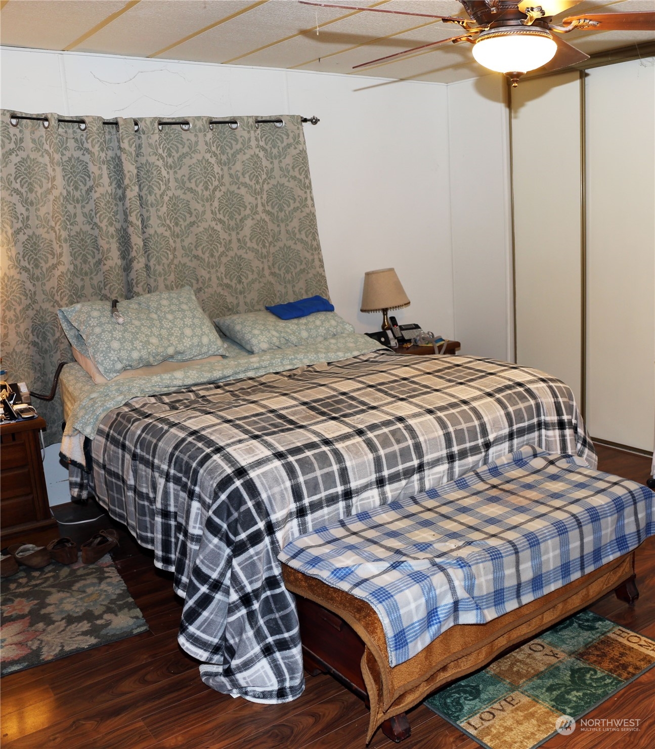 802 South Military Road Winlock, WA 98596 - Photo 11 of 14 a bedroom with a bed and lamp chandelier