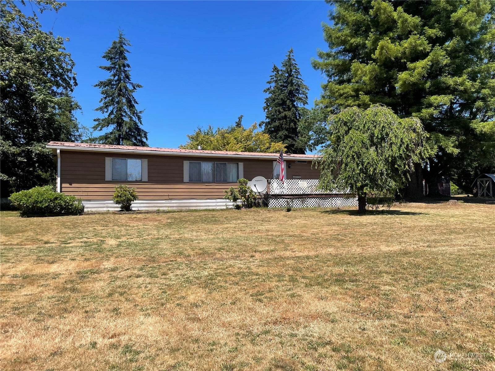 802 South Military Road Winlock, WA 98596 - Photo 2 of 14 a front view of a house with a yard