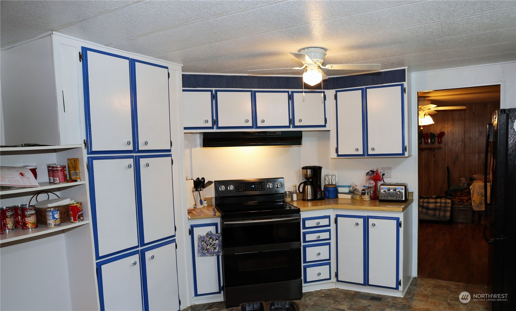 802 South Military Road Winlock, WA 98596 - Photo 3 of 14 a kitchen with stainless steel appliances a refrigerator sink and cabinets