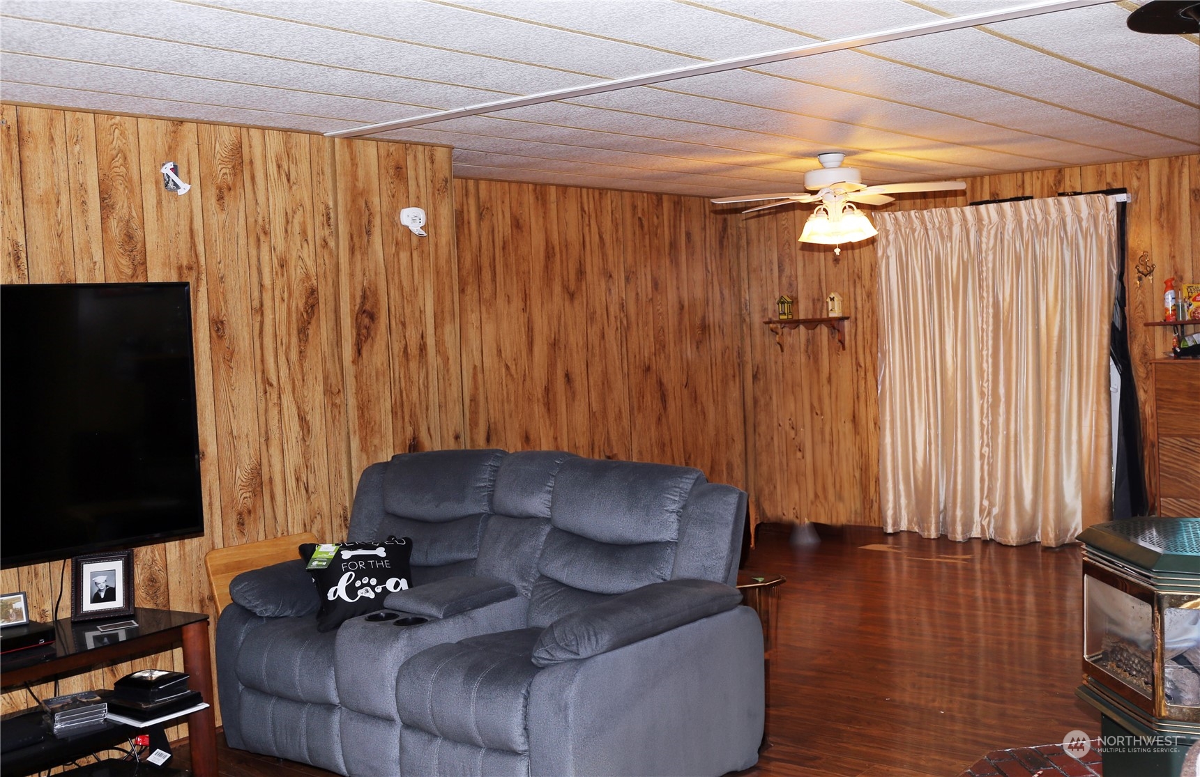 802 South Military Road Winlock, WA 98596 - Photo 8 of 14 a living room with furniture and a flat screen tv