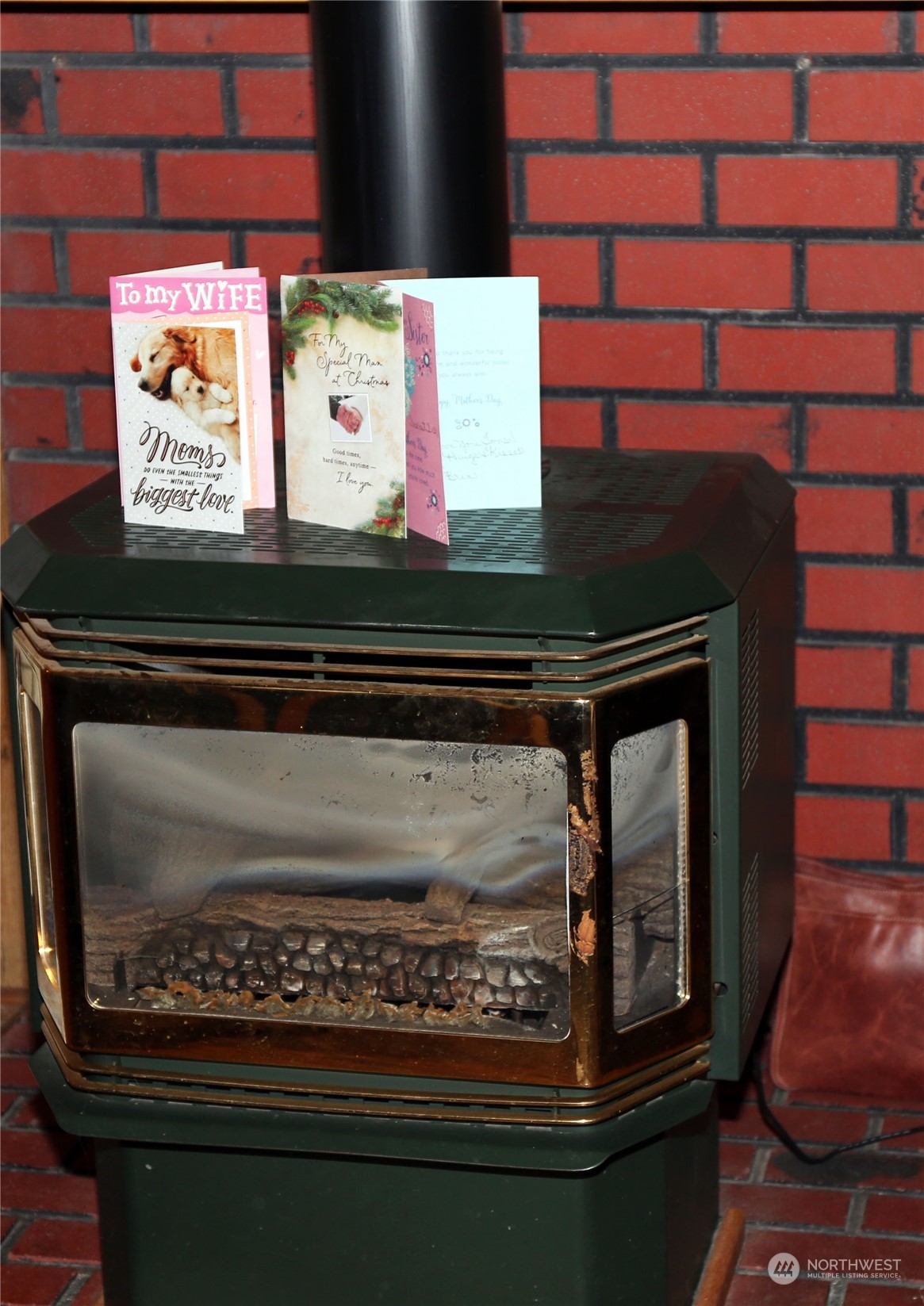 802 South Military Road Winlock, WA 98596 - Photo 9 of 14 a picture of a fireplace with wooden floor