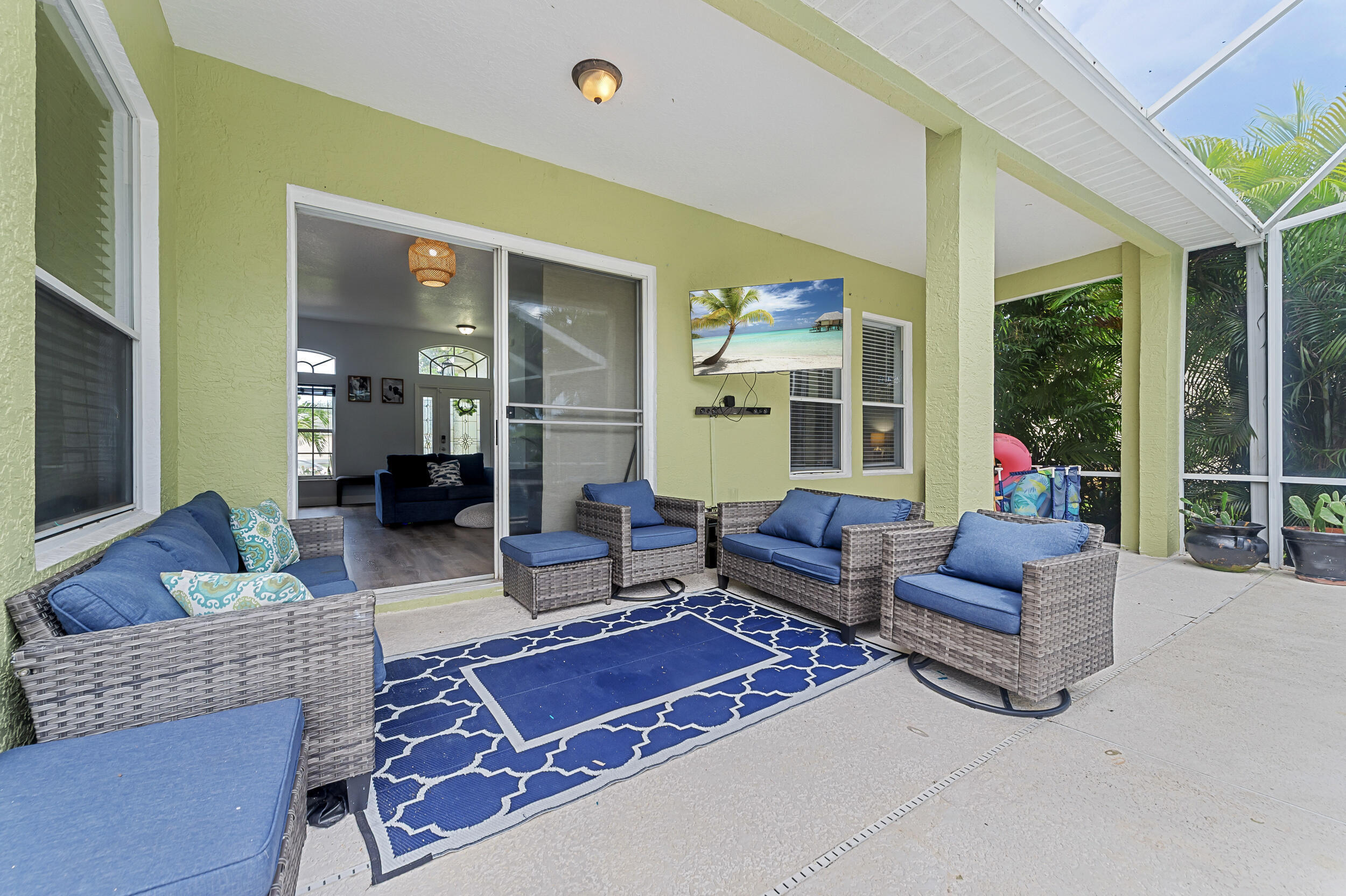 3183 Southwest Ann Arbor Road Port St. Lucie, FL 34953 - Photo 11 of 16 a living room with furniture rug and a large window