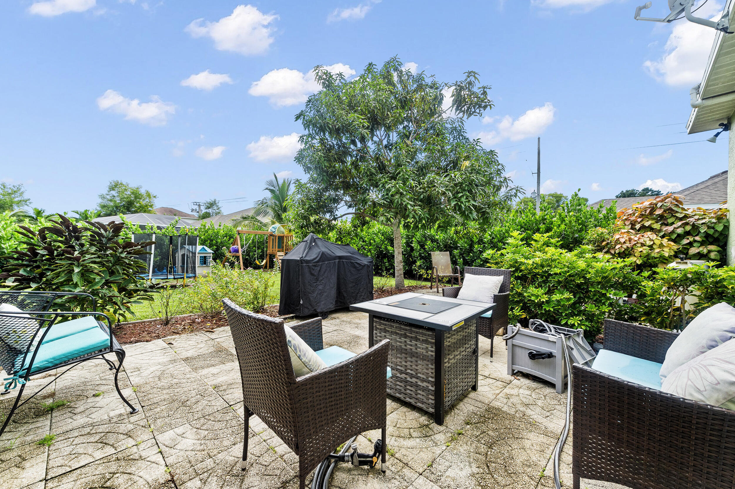 3183 Southwest Ann Arbor Road Port St. Lucie, FL 34953 - Photo 14 of 16 a view of a chairs and table in the patio