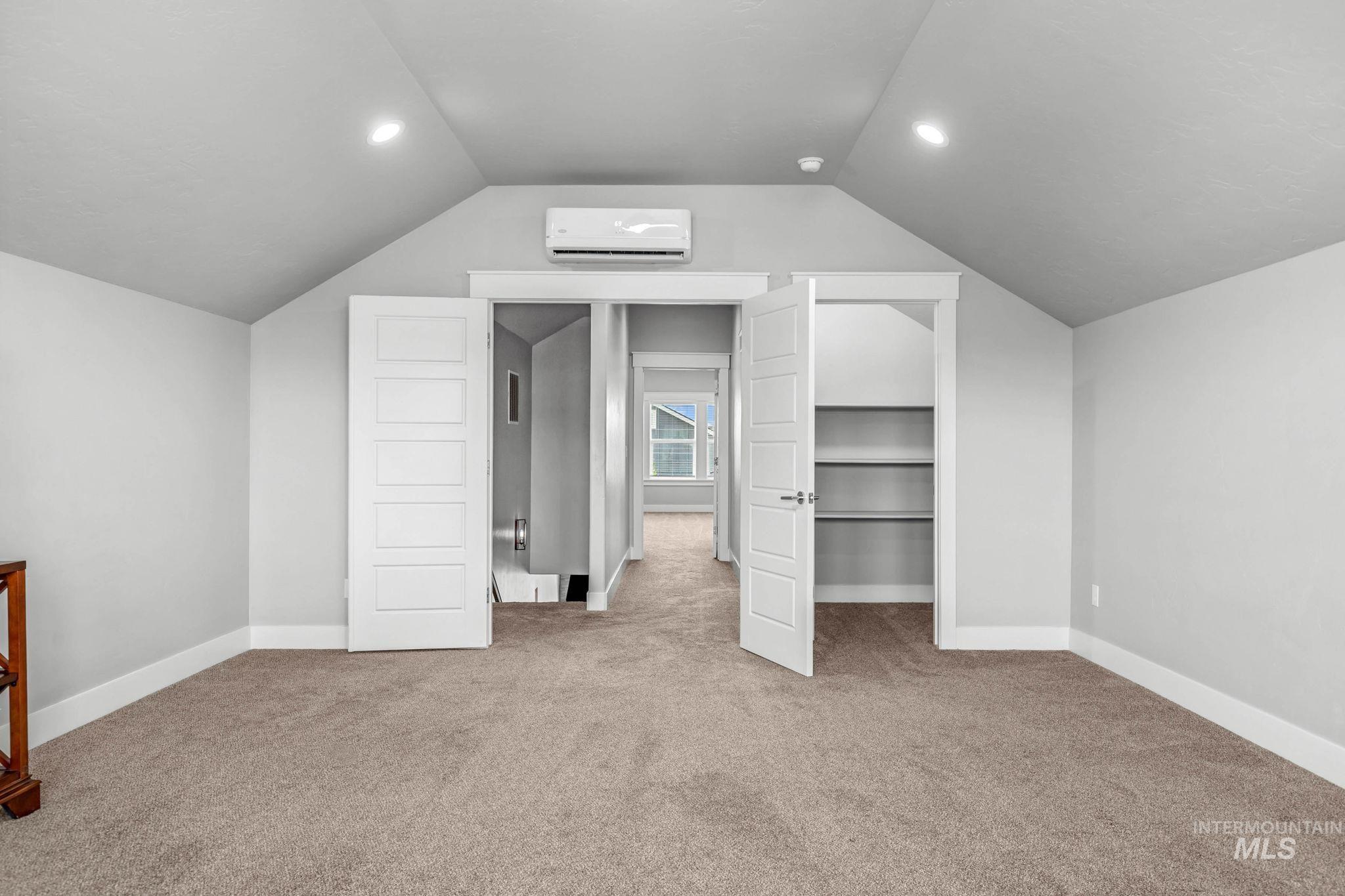 2934 East Murchison Street Meridian, ID 83642 - Photo 35 of 44 Carpeted room featuring a vaulted ceiling and recessed lighting