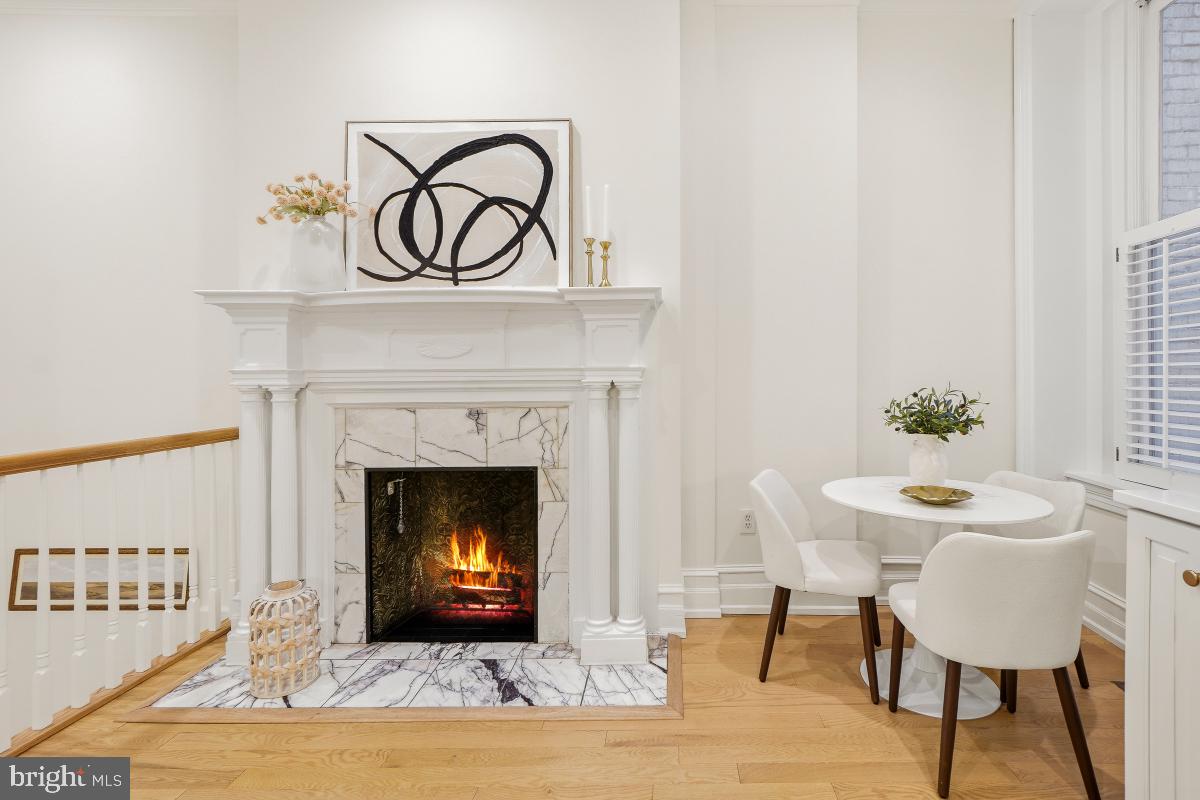 1706 16th Street Northwest, Unit 1 Washington, DC 20009 - Photo 12 of 55 Original wood burn fireplace w/ marble surround.