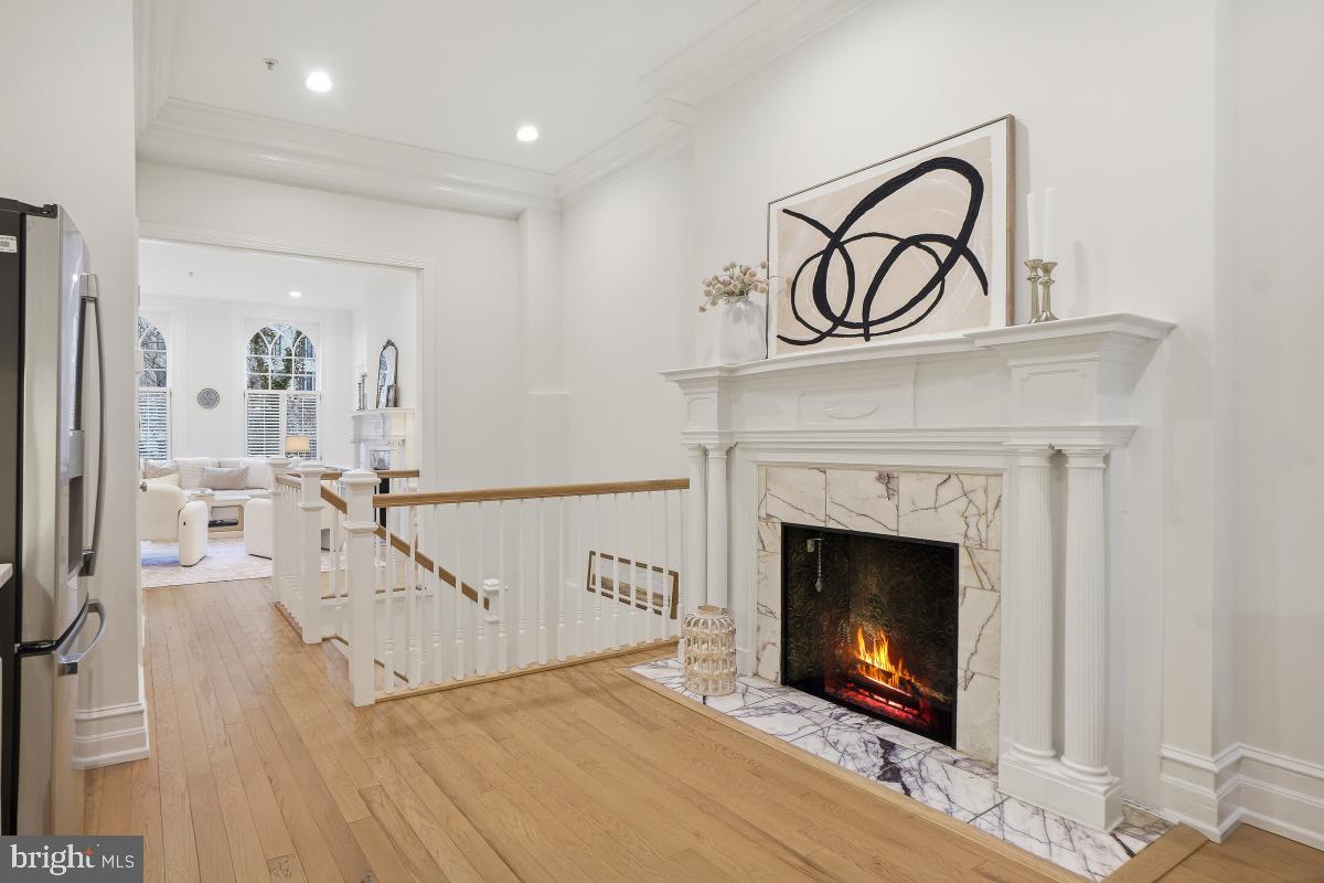 1706 16th Street Northwest, Unit 1 Washington, DC 20009 - Photo 18 of 55 a living room with a fireplace with wooden floor