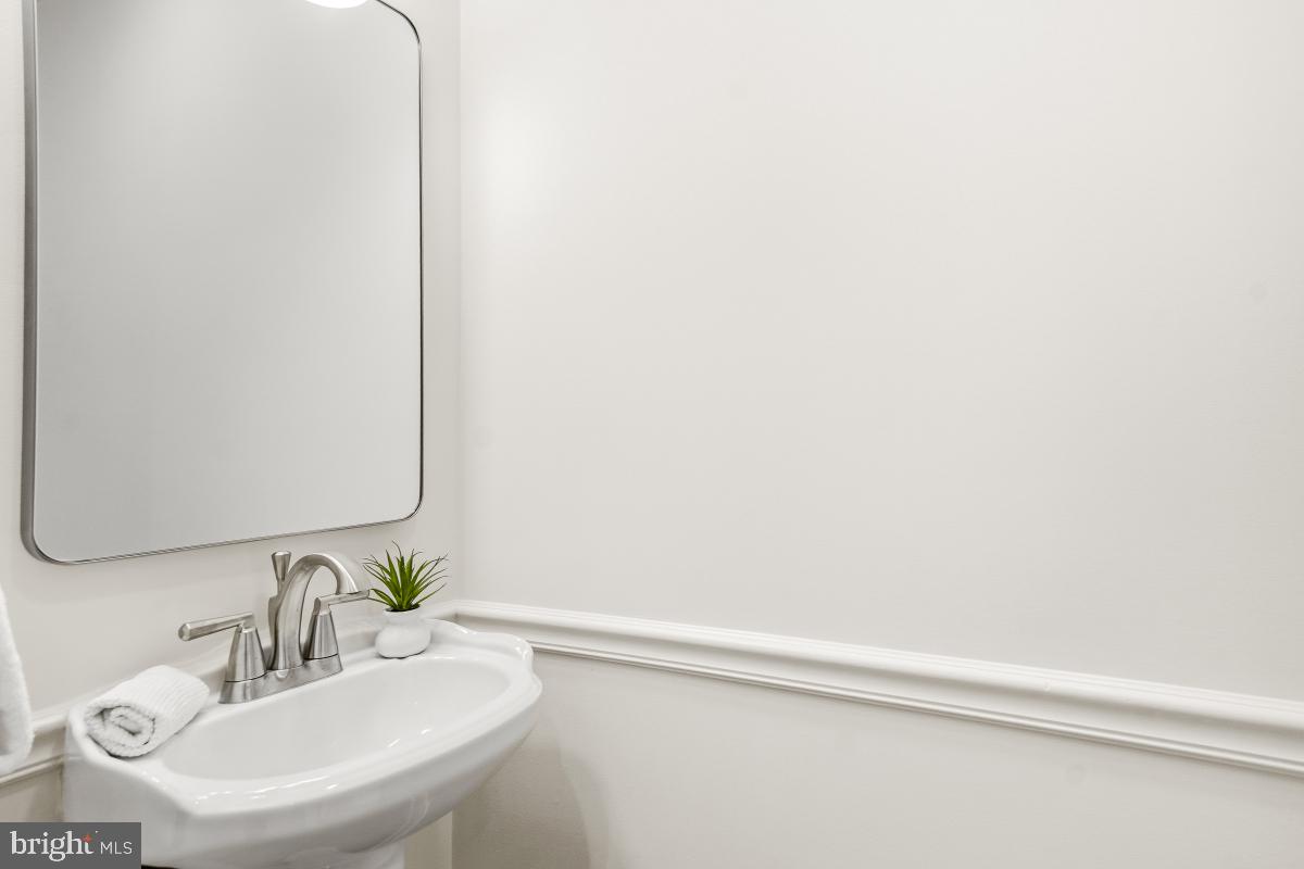 1706 16th Street Northwest, Unit 1 Washington, DC 20009 - Photo 19 of 55 a bathroom with a sink and a mirror