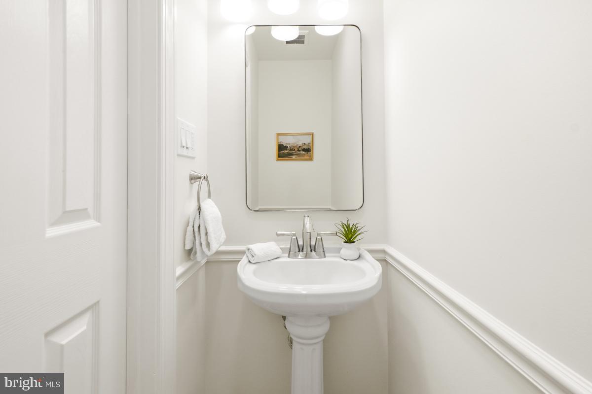 1706 16th Street Northwest, Unit 1 Washington, DC 20009 - Photo 20 of 55 a bathroom with a sink and a mirror