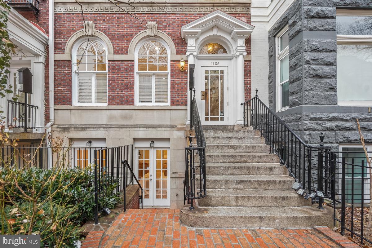 1706 16th Street Northwest, Unit 1 Washington, DC 20009 - Photo 2 of 55 a front view of a house with glass windows and brick walls