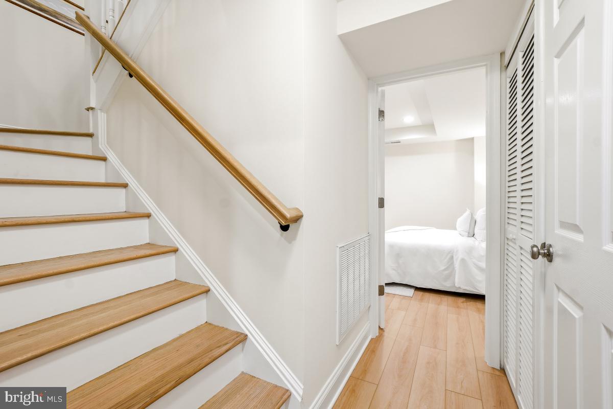 1706 16th Street Northwest, Unit 1 Washington, DC 20009 - Photo 21 of 55 a view of a hallway with wooden floor and staircase