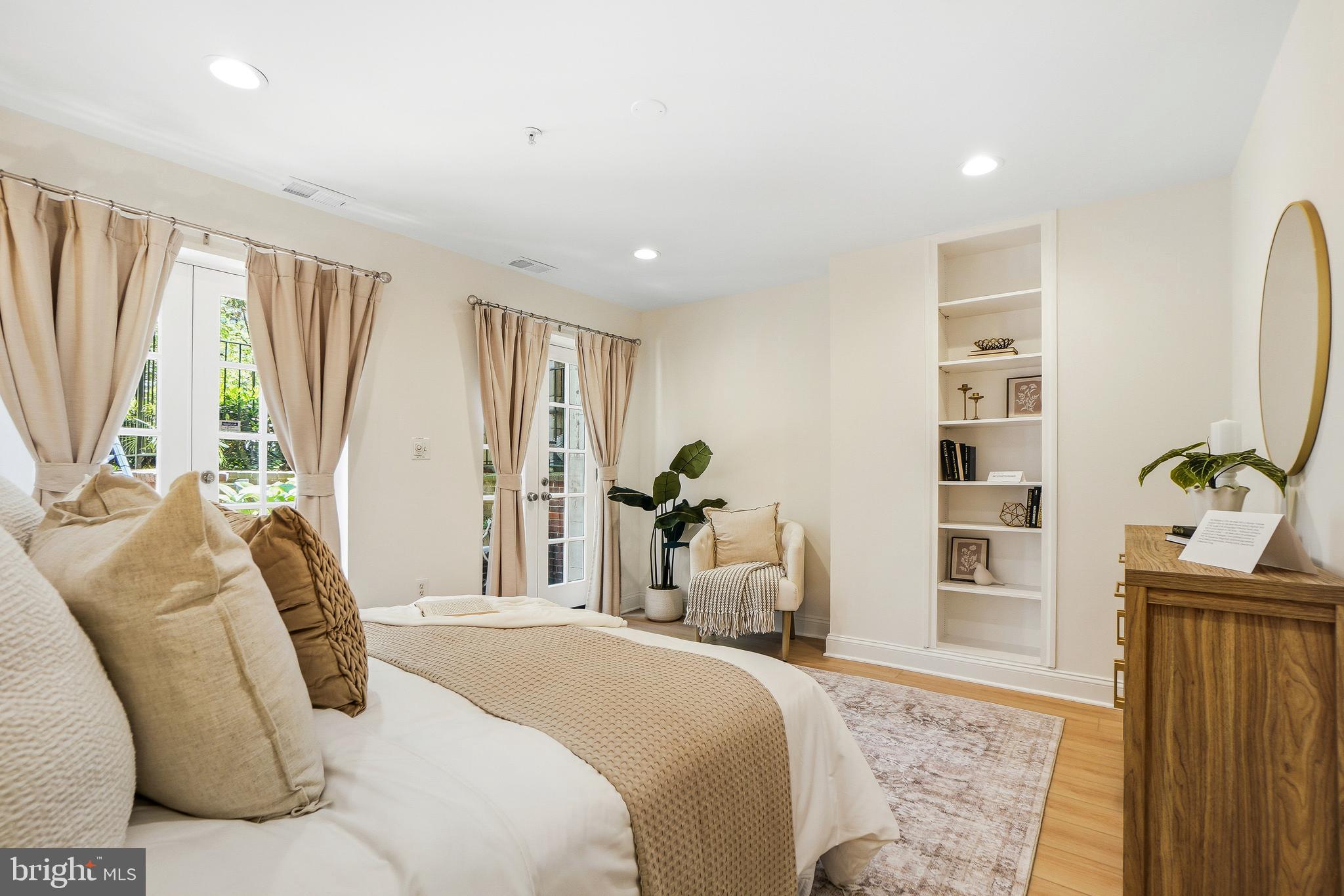 1706 16th Street Northwest, Unit 1 Washington, DC 20009 - Photo 23 of 55 a bedroom with a bed and a large window