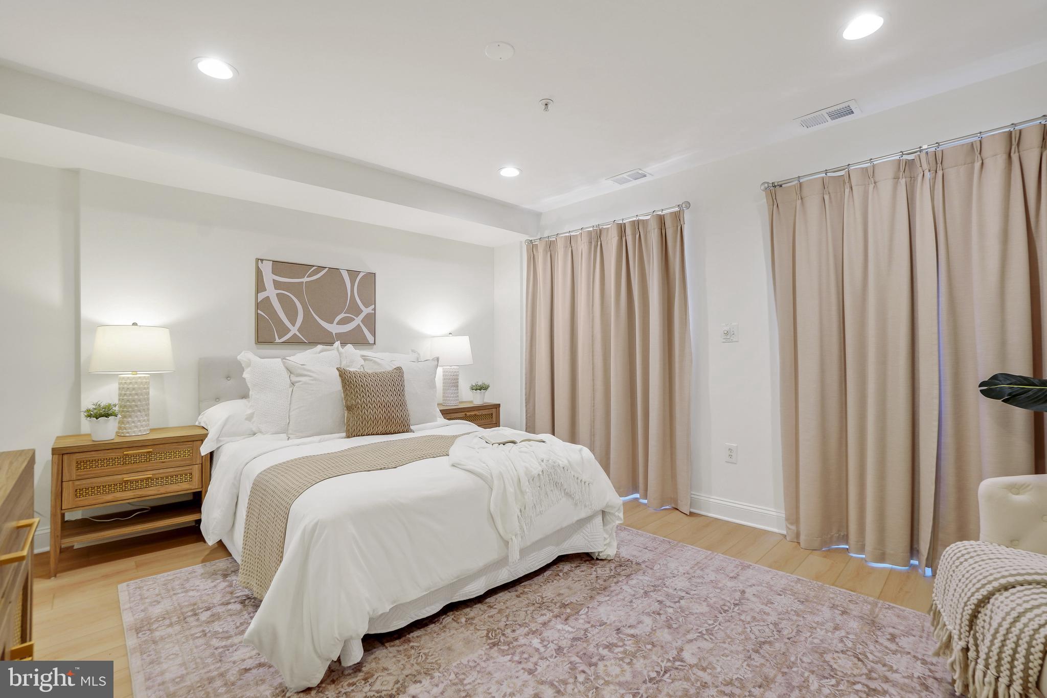 1706 16th Street Northwest, Unit 1 Washington, DC 20009 - Photo 27 of 55 a bedroom with a bed and a mirror